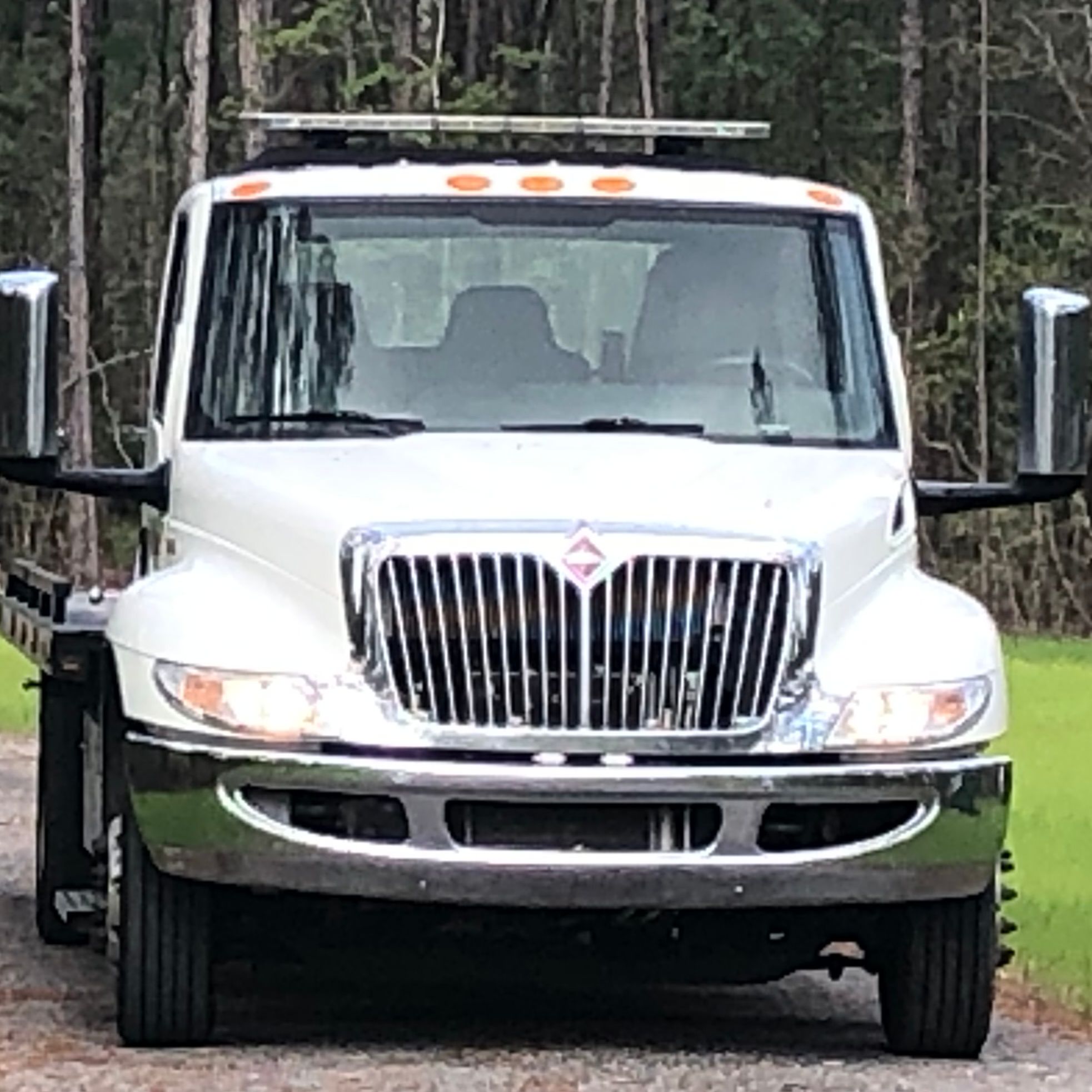 C.J. And Son's Towing Service logo