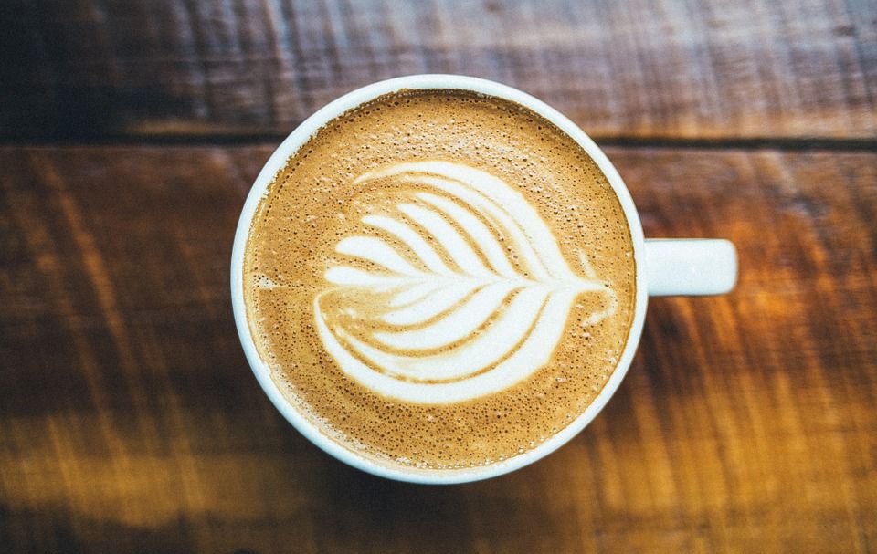 Marq' E Donuts &amp; Coffee logo